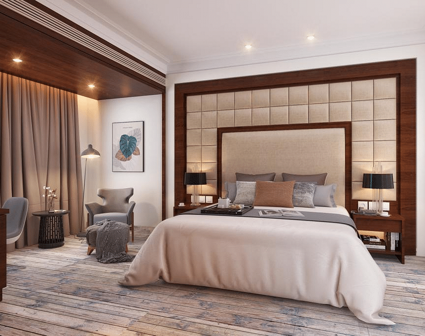 Suite with a king size bed and lamps on each side of the bed at BluSalzz Residence, Amritsar.